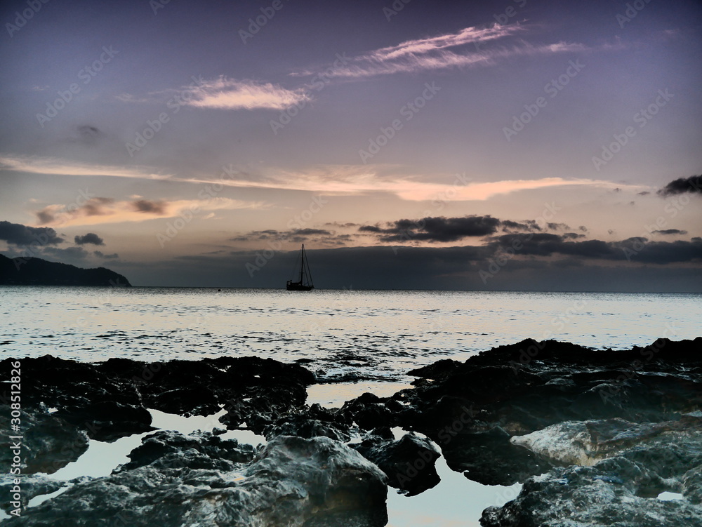 Impressively artful colours at sunrise over the sea at Cala Millor, Majorca