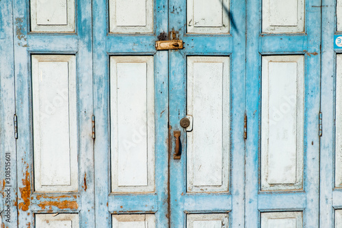old wooden door with lock blue color