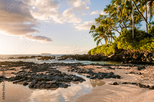 Sunset view of beautiful tropical beach, Secret Wedding Beach, Makena Cove, Maui, Hawai photo