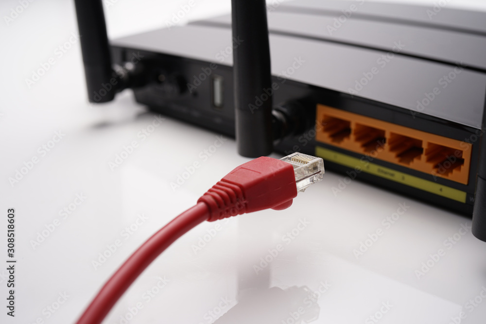 Backside view of dual band wifi router with cat-6 cable connected to the  modem. Internet security conceptual Stock Photo | Adobe Stock