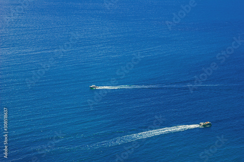 Beautiful summer sea landscape with powerboats at the resort in the blue water.