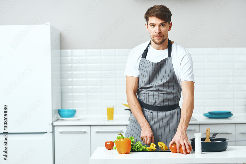 man cooking in kitchen man cooking in kitchen