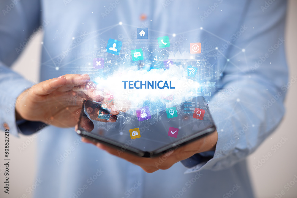 Businessman holding a foldable smartphone with TECHNICAL inscription, technology concept Businessman holding a foldable smartphone with TECHNICAL inscription, technology concept