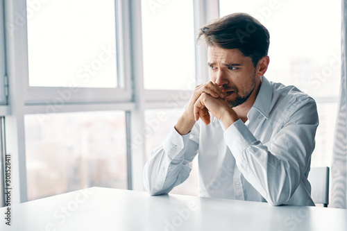 businessman talking on phone in office