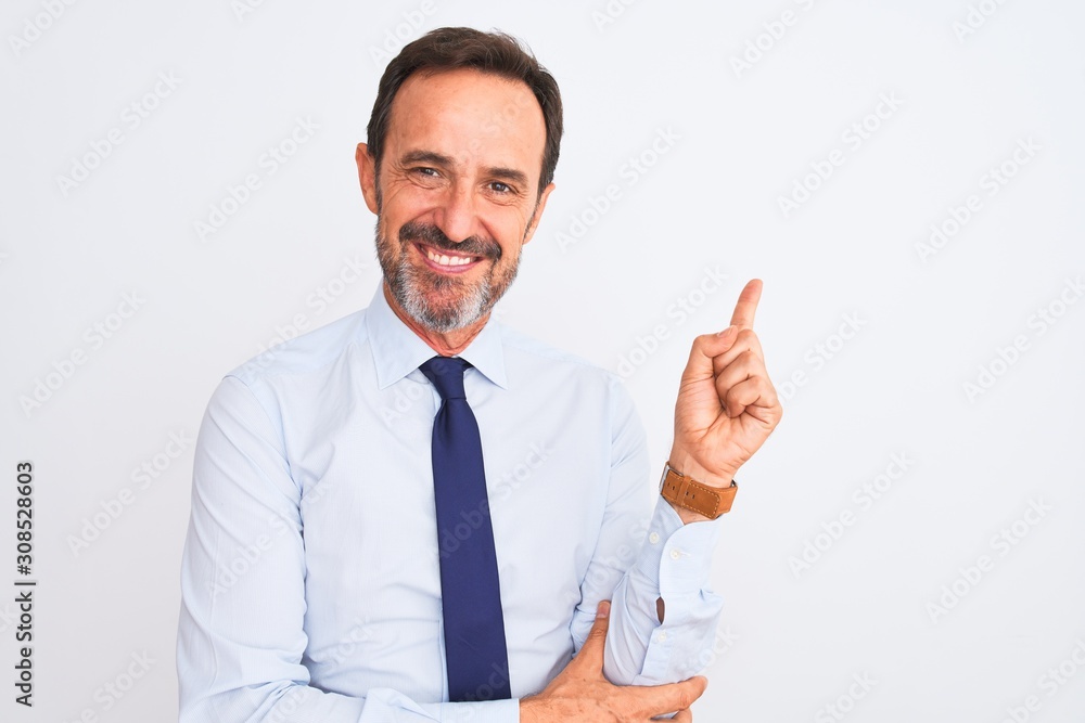 Middle age businessman wearing elegant tie standing over isolated white background with a big smile on face, pointing with hand and finger to the side looking at the camera. Middle age businessman wearing elegant tie standing over isolated white background with a big smile on face, pointing with hand and finger to the side looking at the camera.
