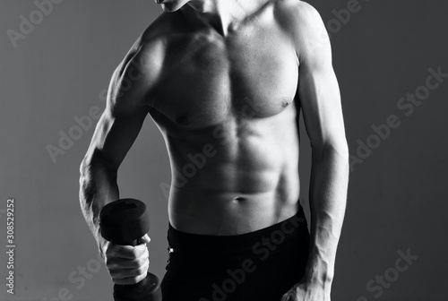 muscular bodybuilder posing on black background
