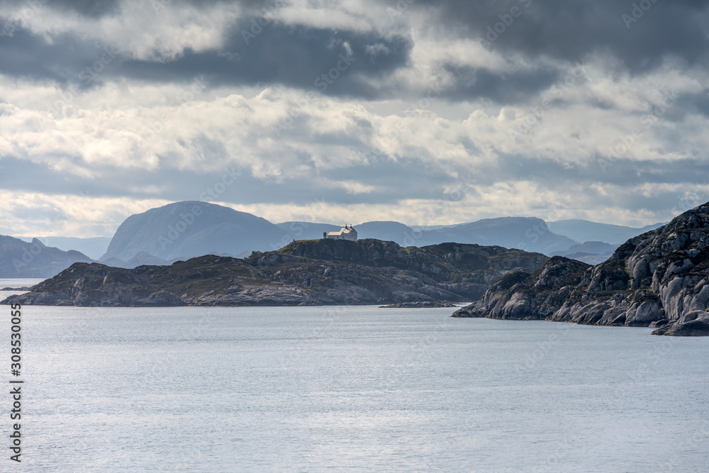 lone house on cliff in fjord, Instegeita, Norway lone house on cliff in fjord, Instegeita, Norway