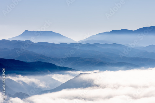 View of the Guillerias mountains in a foggy sunrise, Catalonia, Spain