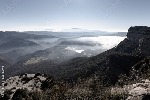 View from the top of the cliffs of Collsacabra as the fog from the mountains and valleys of the Guillerias dissipates  Catalonia  Spain