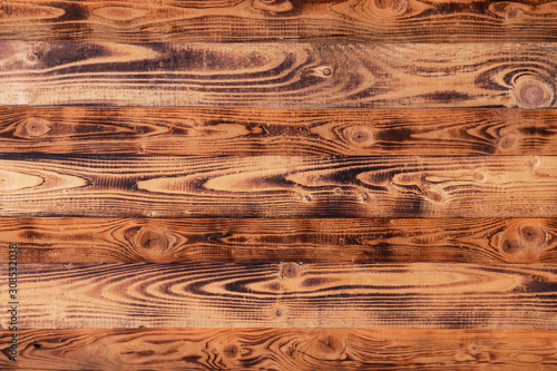 Dark brown wooden boards wall pattern texture background