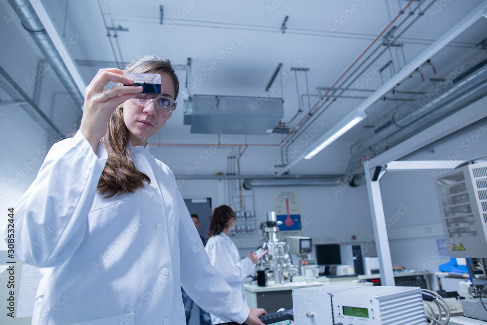 Two female technicans working in a technical laboratory Two female technicans working in a technical laboratory