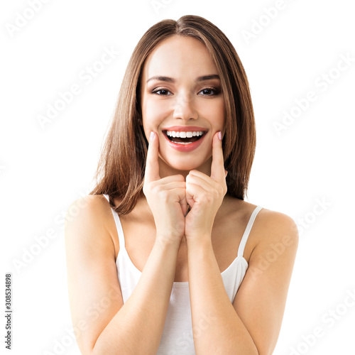 Lovely brunette girl showing toothy smile, in casual smart clothing, isolated against white background