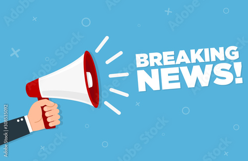Hand holding megaphone breaking news concept