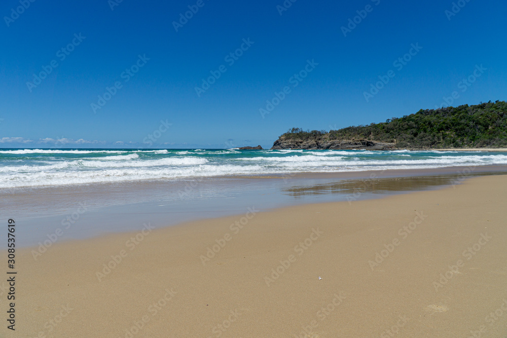 the beautiful beach of Noosa on the sunshine coast in Australia with beautiful weather and blue sky with white clouds