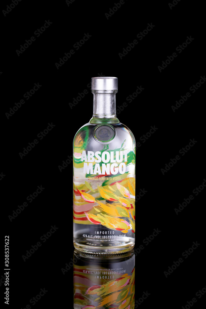 UFA, RUSSIA, December 03 2019: A bottle of Swedish vodka Absolut Mango  isolated on black background with reflection. Stock Photo | Adobe Stock