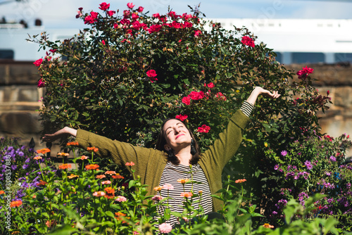 happy woman in urban garden