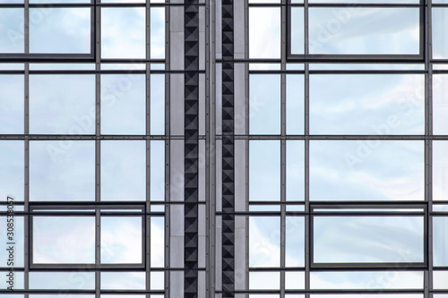 Realistic though unreal reworked photo of modern glass architecture. Windows of different shapes. Financial business building. Hi-tech composition with rectangular frames background and sky reflection