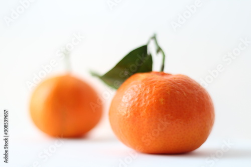 tangerines with leaves isolated on white background
