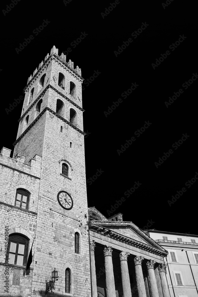Medieval People's Tower and ancient roman Temple of Minerva in Assisi Communal Square (Black and White with copy space)