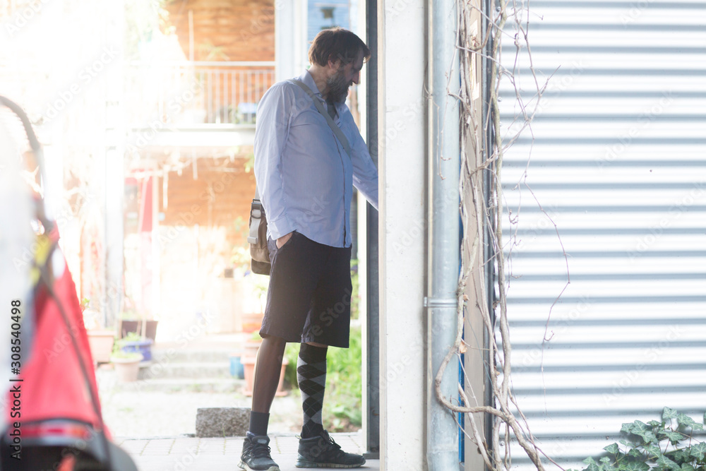 older man with prosthetic leg coming home older man with prosthetic leg coming home
