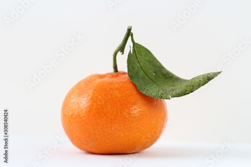 tangerine with leaves isolated on white background