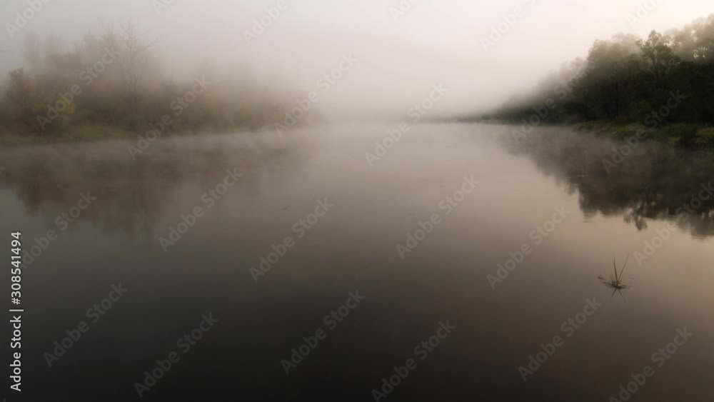 The remain of the reef of the ancient sea, composed of limestone - shikhan Kushtau. Fog on the Belaya river. Aerial view. The remain of the reef of the ancient sea, composed of limestone - shikhan Kushtau. Fog on the Belaya river. Aerial view.