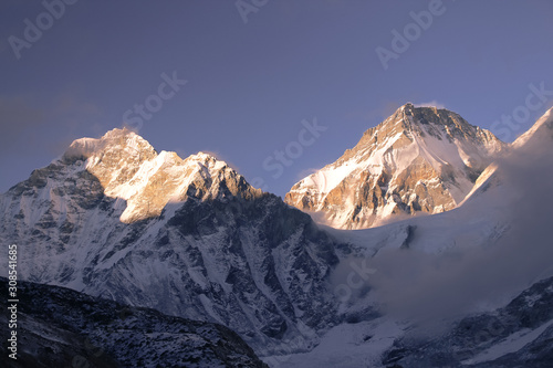 View of Khumbutse and Changtse mountain peaks from Gorak Shep (or Gorakshep) village at sunset. The summit of the mountain Khumbutse is right on the border between China and Nepal.