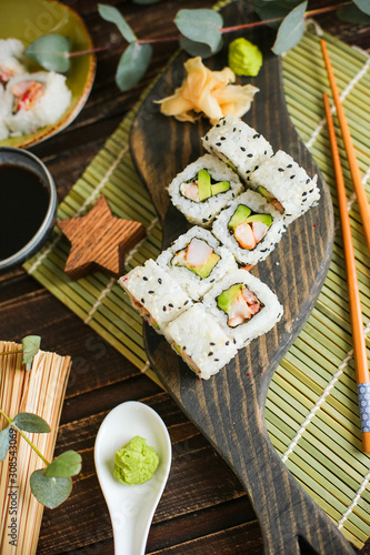 sushi with salmon and avocado. Sushi roll with salmon and tempura shrimp