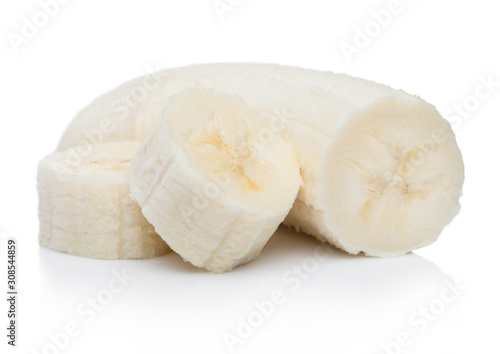 Fresh ripe organic banana sliced pieces on white background with reflection.