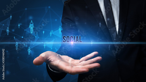 Elegant hand holding SOCIAL inscription, social networking concept