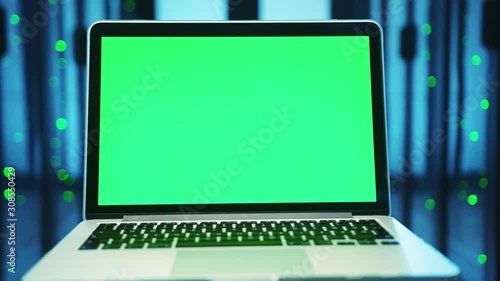 Wallpaper Mural Mock-up chroma key laptop with green screen isolated inside server room. Close-up notebook control device in futuristic high tech database of cyber security. Torontodigital.ca