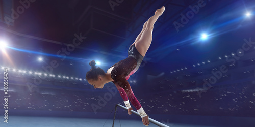 Female gymnast on professional arena. © Victoria VIAR PRO