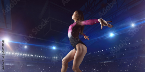 Female gymnast on professional arena. © Victoria VIAR PRO
