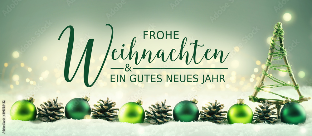 Fototapeta Frohe Weihnachten und ein gutes neues Jahr - Weihnachtskarte deutsche Sprache - Deko aus Tannenzapfen, Baum und Christbaumkugeln