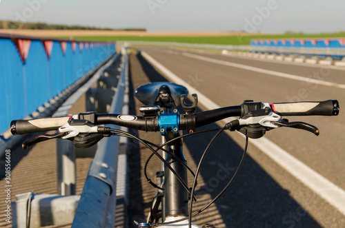 Bicycle is on the road. Tourism on the bike.