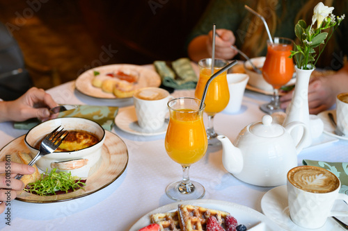 morning Breakfast or brunch in the restaurant. table with drinks and food. selective focus