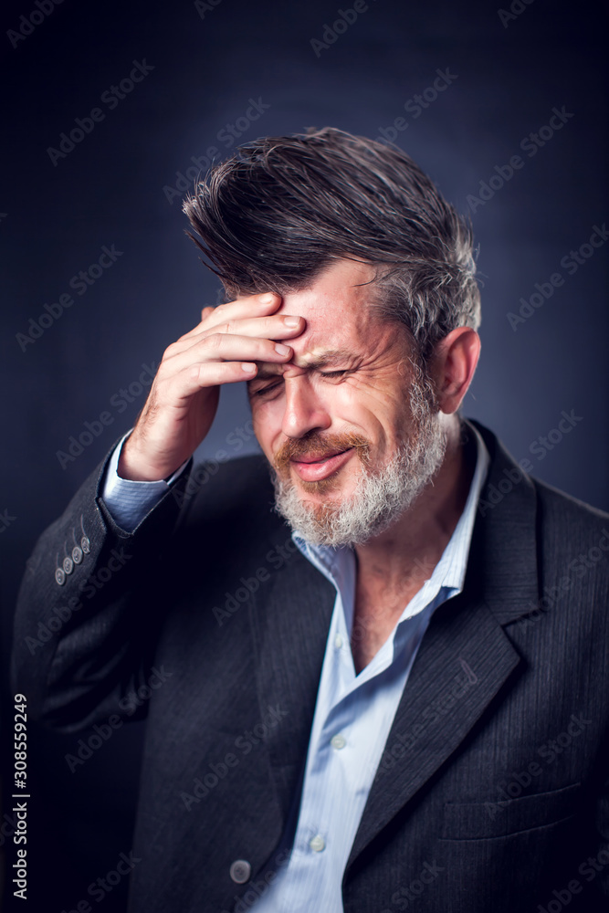 A portrait of bearded man with iroquois wearing suit showing has problems. People and emotions concept A portrait of bearded man with iroquois wearing suit showing has problems. People and emotions concept
