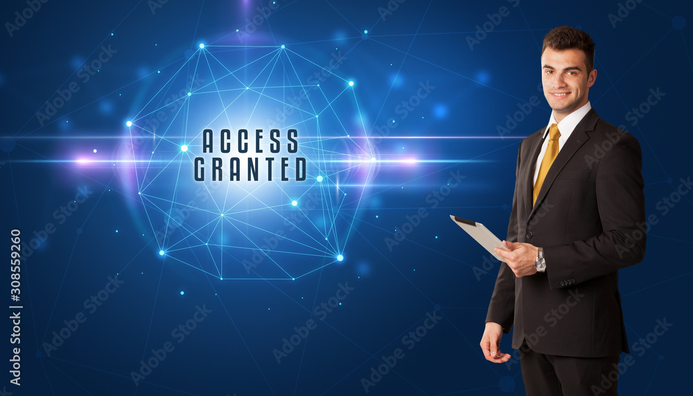 Businessman thinking about security solutions with ACCESS GRANTED inscription Businessman thinking about security solutions with ACCESS GRANTED inscription