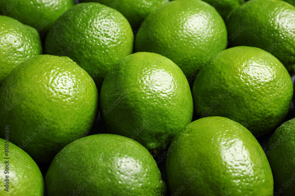 Fresh ripe green limes as background, closeup Fresh ripe green limes as background, closeup