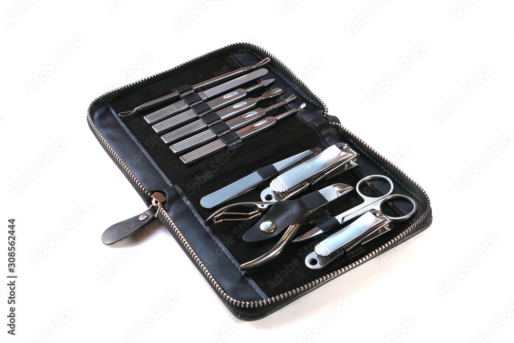 Metallic manicure set with black case on an isolated white background. Beauty salon and tools for nails. Women's handbag gift Metallic manicure set with black case on an isolated white background. Beauty salon and tools for nails. Women's handbag gift