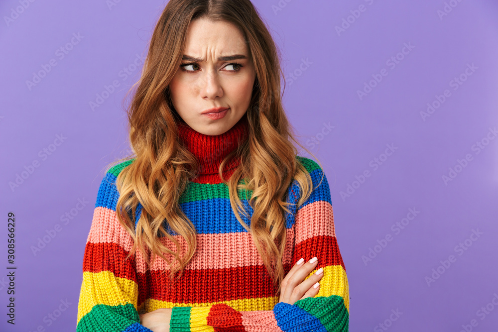 Cute young girl wearing colorful sweater standing isolated Cute young girl wearing colorful sweater standing isolated