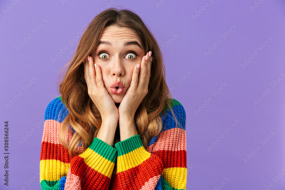 Cute young girl wearing colorful sweater standing isolated Cute young girl wearing colorful sweater standing isolated