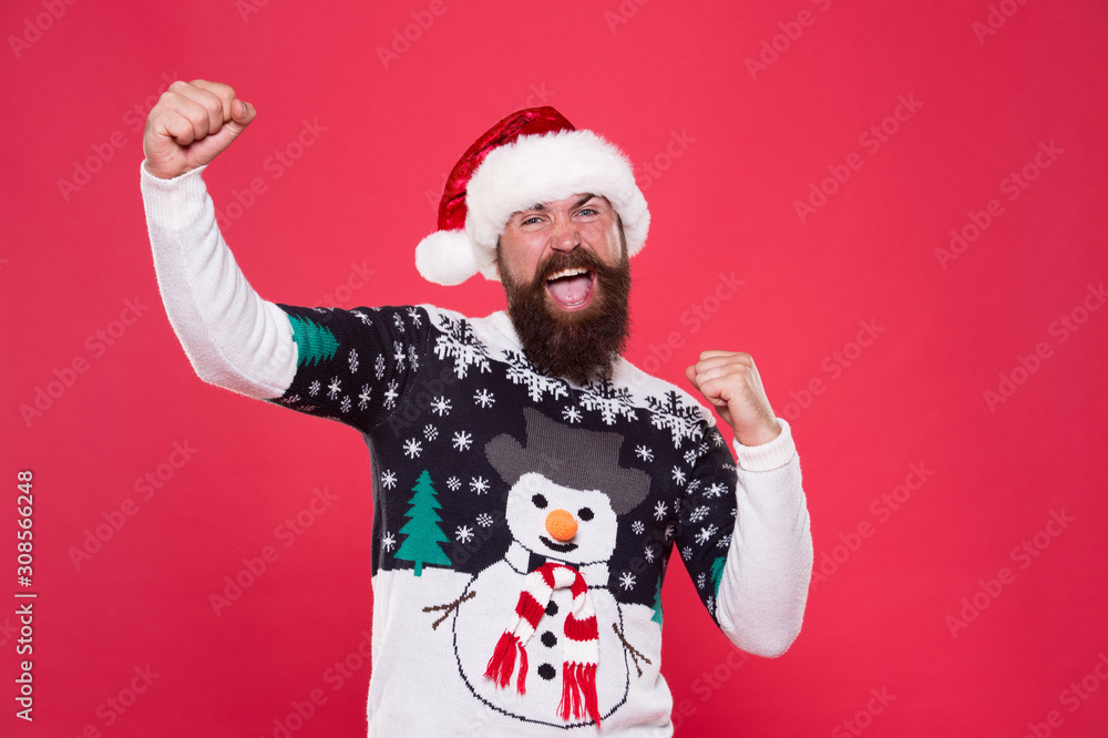 Holiday atmosphere. ready for new year. merry christmas. happy bearded man red santa hat. cheerful hipster favorite funny sweater with snowman. winter holiday fun. seasonal warm clothes fashion