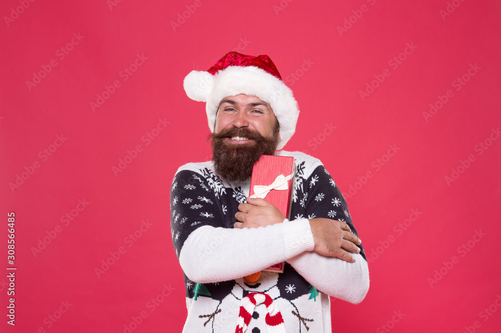 Man celebrate holiday with gift box. Hipster in winter sweater. Shopping satisfaction. Respect traditions. Merry christmas. Seasonal discount. Gift from santa. Happy new year. Christmas gift concept Man celebrate holiday with gift box. Hipster in winter sweater. Shopping satisfaction. Respect traditions. Merry christmas. Seasonal discount. Gift from santa. Happy new year. Christmas gift concept