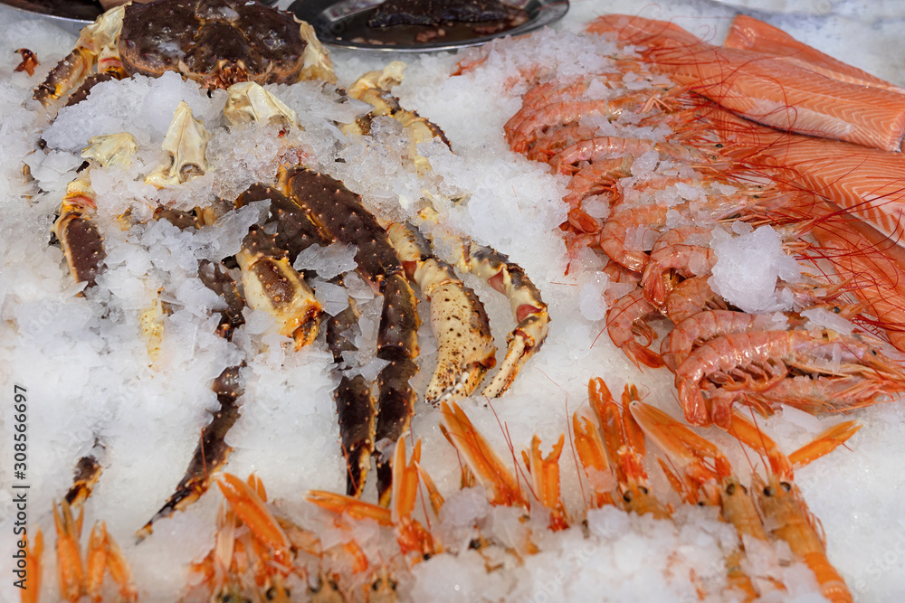 Shrimps, red fish and crabs - sea food fresh mix on ice Shrimps, red fish and crabs - sea food fresh mix on ice