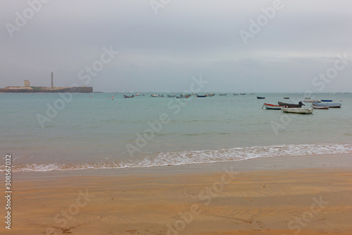 Cadiz sea beach with fishing boats, Spain