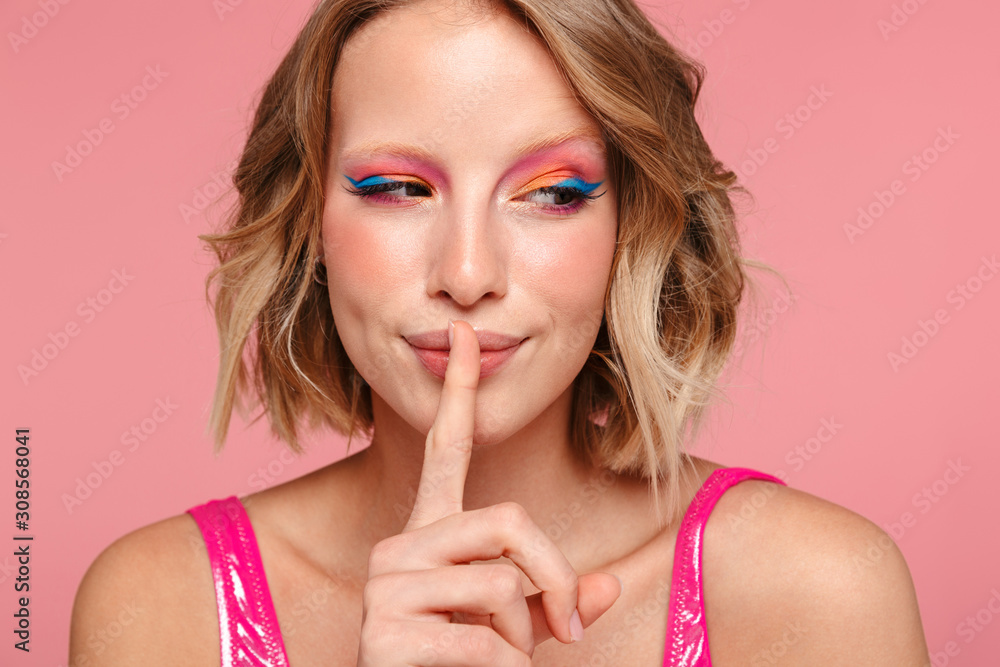Fototapeta premium Portrait of a pretty young girl with bright makeup
