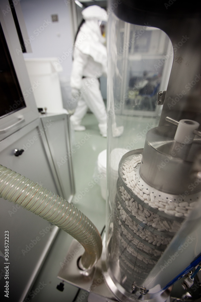 Pharmaceutical pill manufacturing machine Pharmaceutical pill manufacturing machine