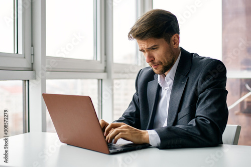 businessman working on laptop in office © SHOTPRIME STUDIO