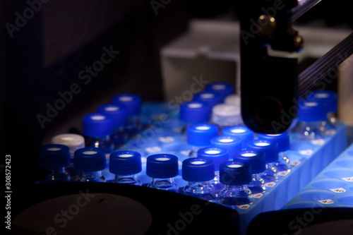 Sample bottles in pharmaceutical laboratory spectrometer photo